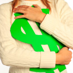 image - hugging a green paper dollar